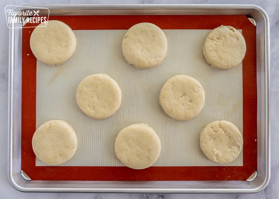 biscuits before they are cooked on a baking sheet