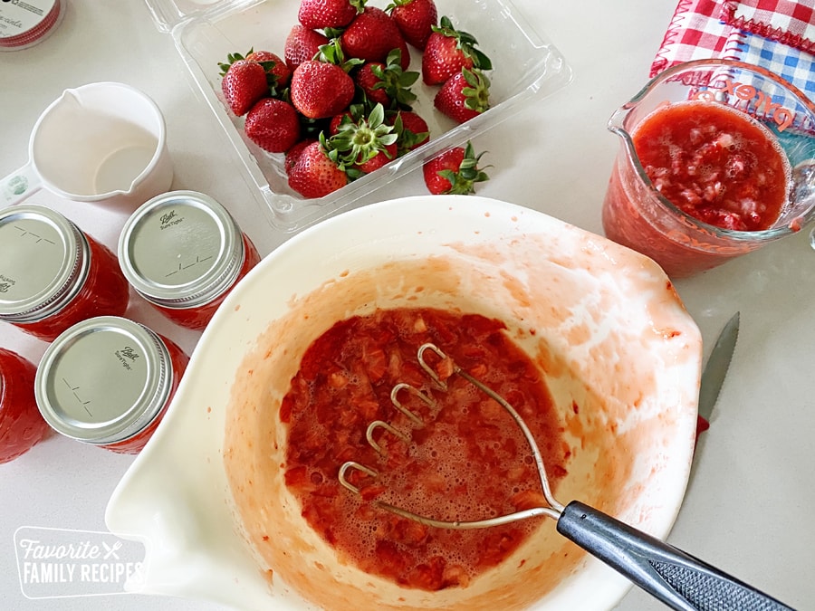 Bowl of mashed strawberries