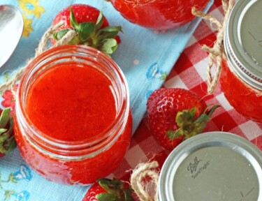 strawberry jam in jars on a tablecloth