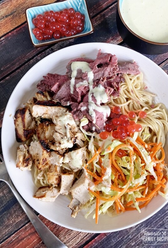 Satu’li bowl with noodles, steak, and chicken