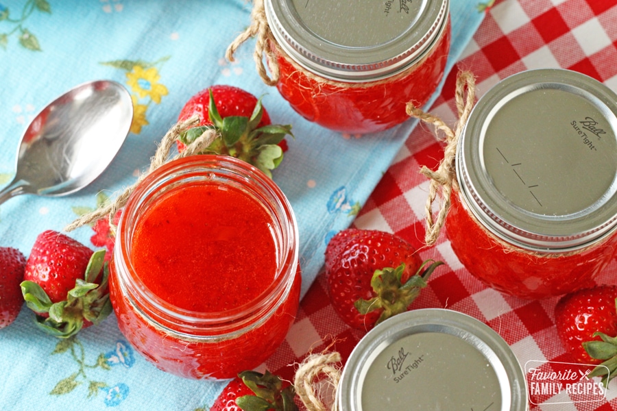 Jam with a spoon with strawberries