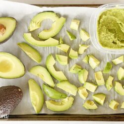 Different sized avocado slices on a tray