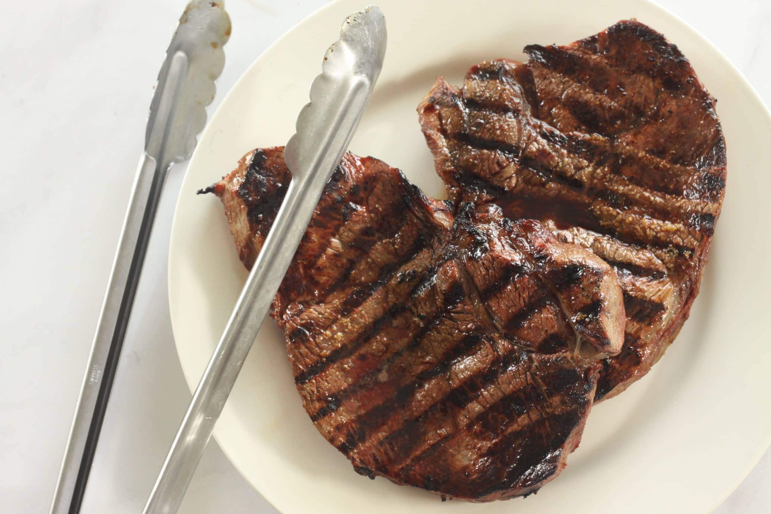 Grilled steak with steak marinade.