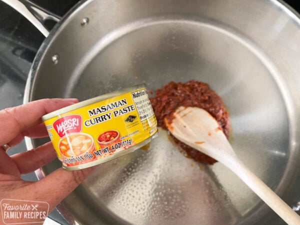 Massaman Curry is one of the easiest and most delicious savory Thai curry dishes. With chicken and potatoes cooked into a sweet, slightly spicy sauce, it's a flavor explosion! Massaman curry paste in a pan.