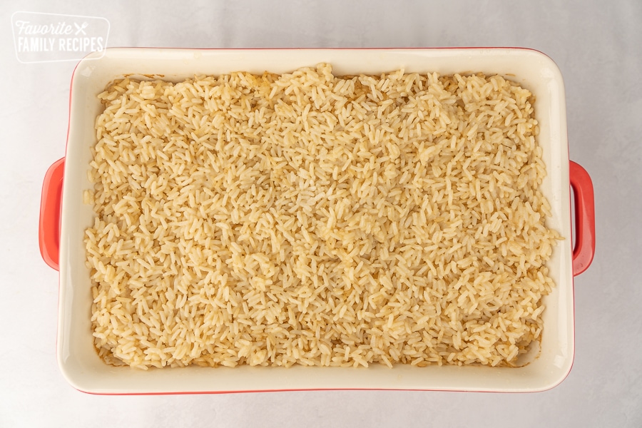 Rice in a large casserole dish.