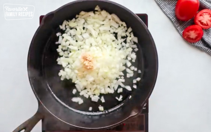Cooking onion and garlic in a large skillet