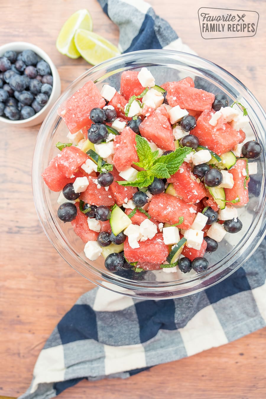 Watermelon Feta Salad in a bowl with a blue plaid napkin to the side