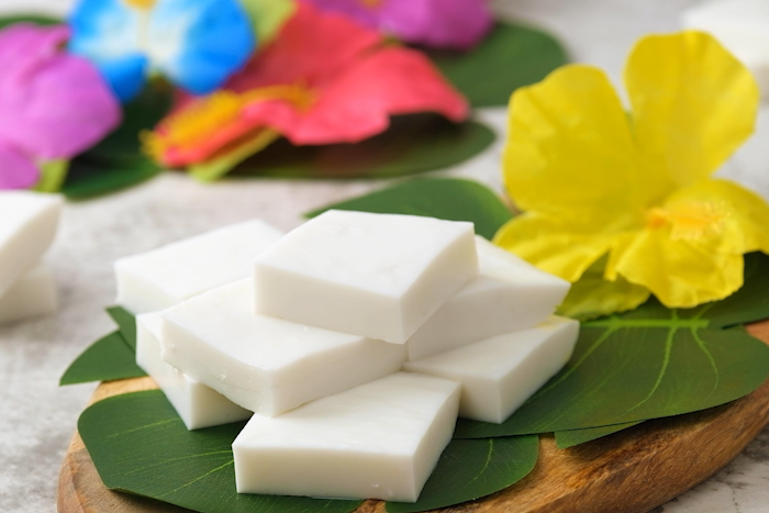 Authentic Hawaiian Haupia (Coconut Pudding) cut into 2 inch squares and served.