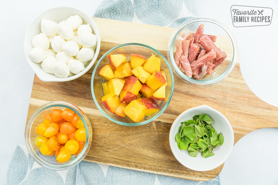 Ingredients for skewers in individual bowls.