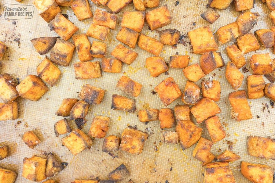 Crispy sweet potatoes on a baking pan.