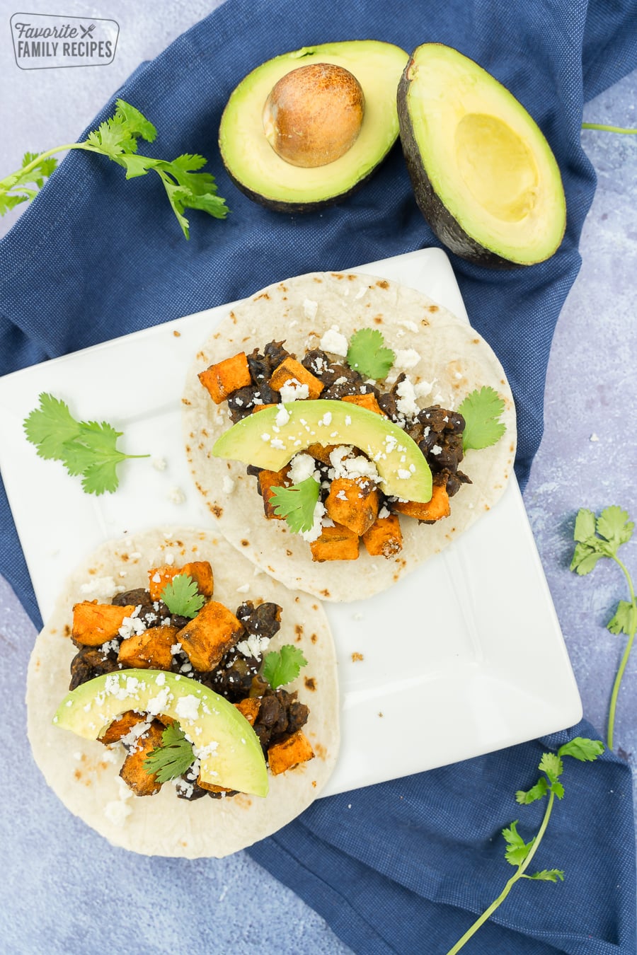 Sweet potato tacos on a white plate.