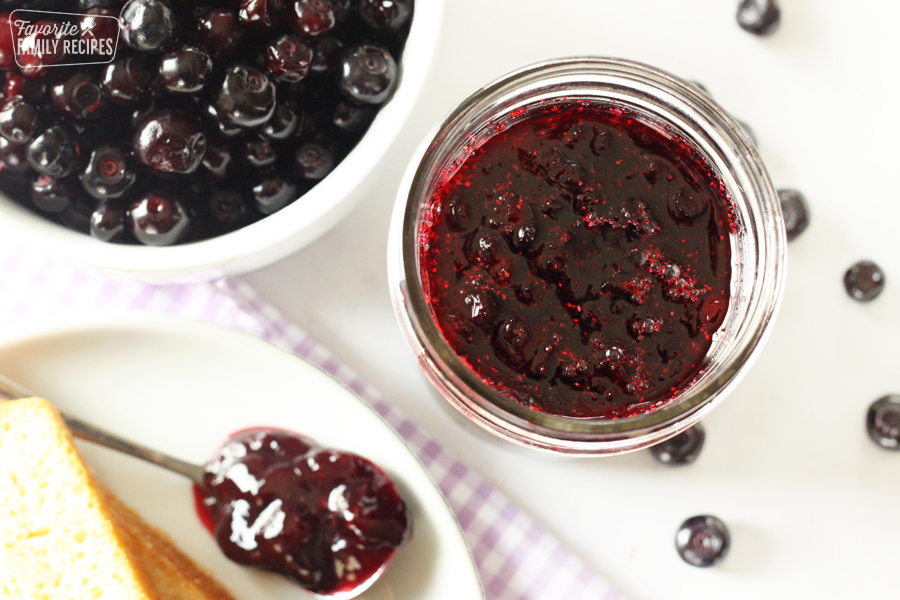 Close up of a jar of huckleberry jam.