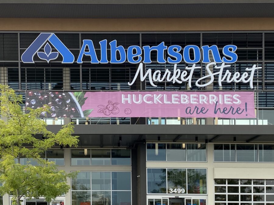 Front of Albertsons store announcing huckleberry season.