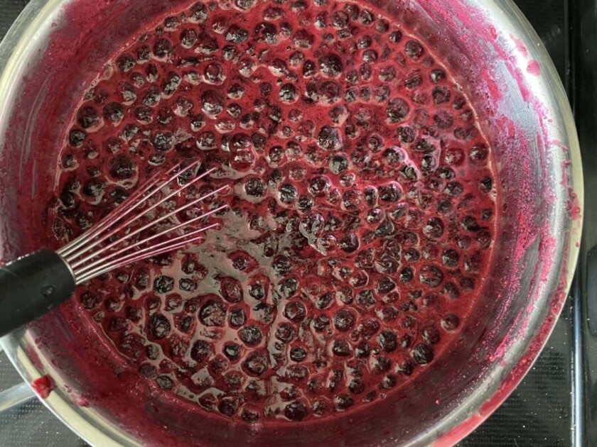 huckleberry jam in a sauce pan