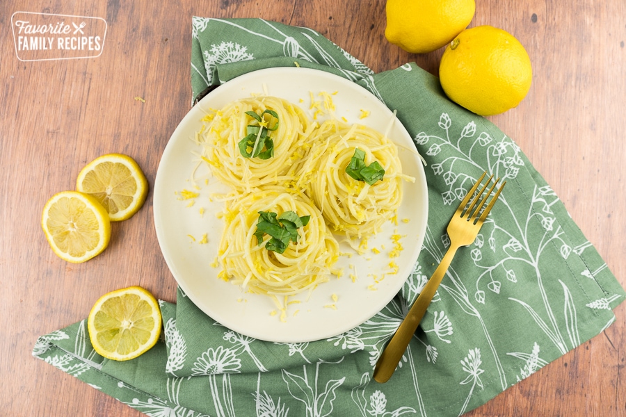 Lemon spaghetti twirled into nests.