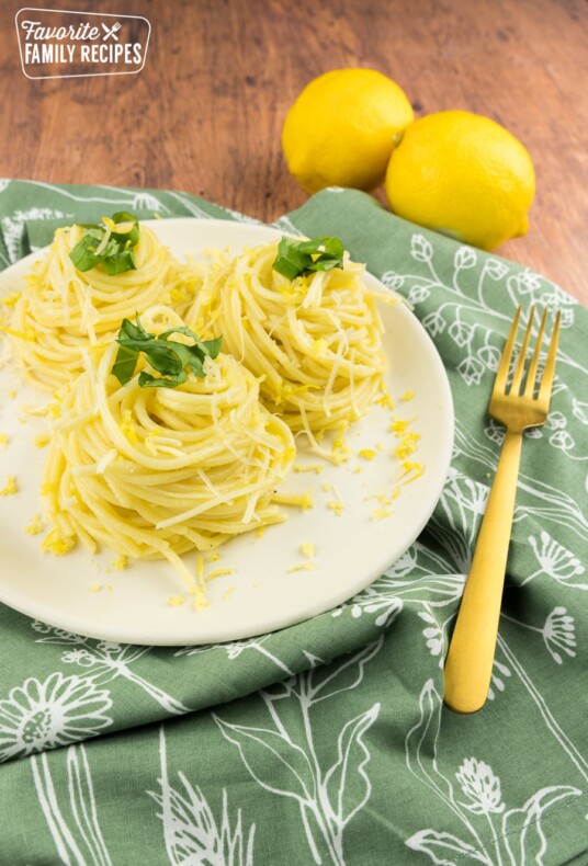 Lemon spaghetti in three mounts with lemons on the side