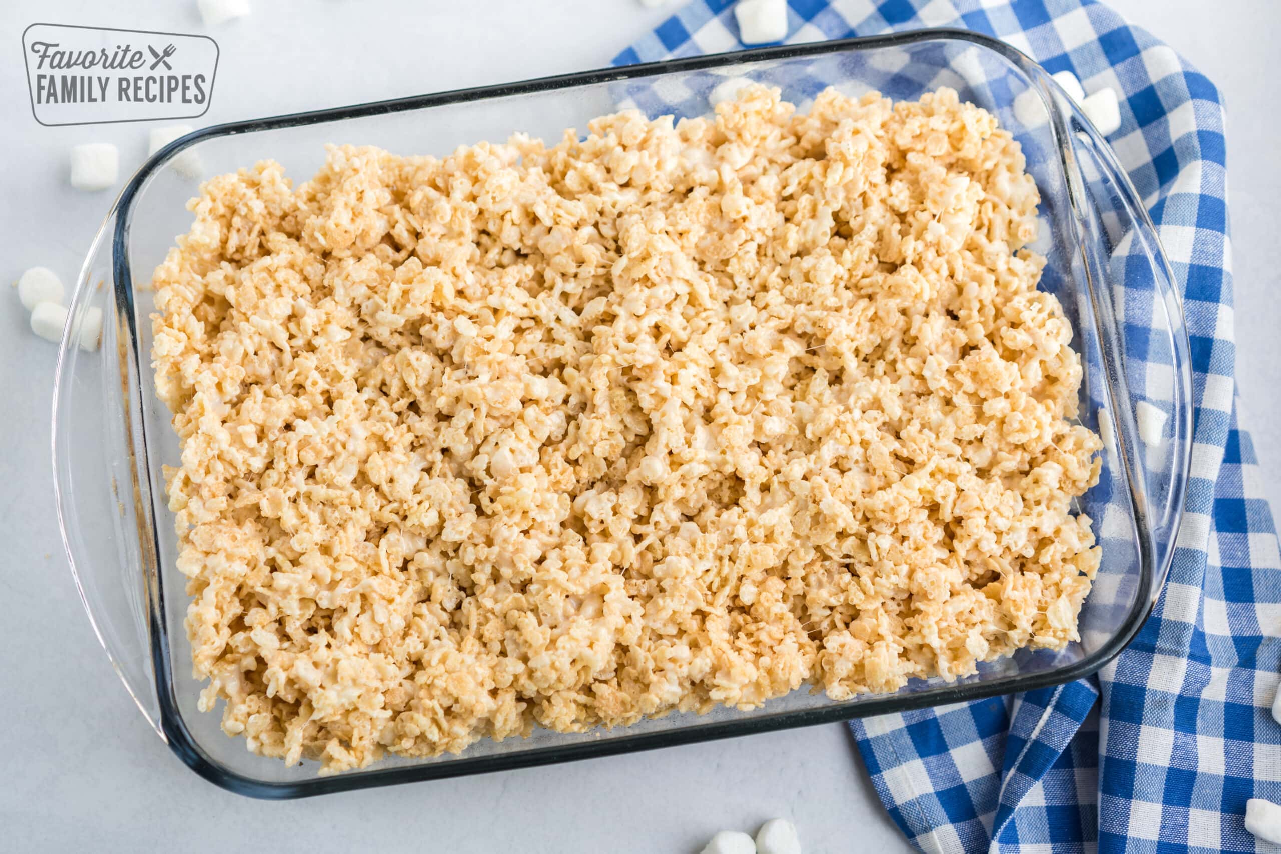 Microwave rice krispie treats in a glass pan.