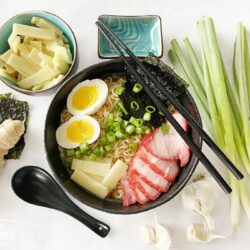 shoyu tamen in a bowl next to ingredients
