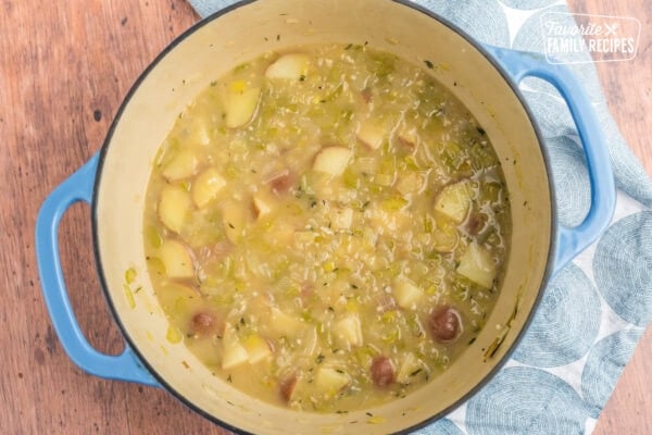 Potatoes, vegetables, and broth in a large stock pot