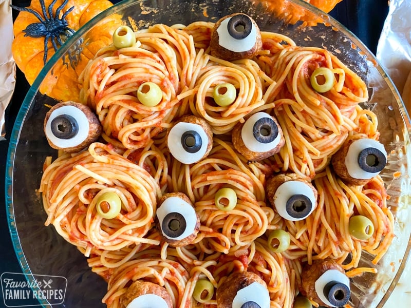 Close up of spaghetti with meatballs that look like eyes