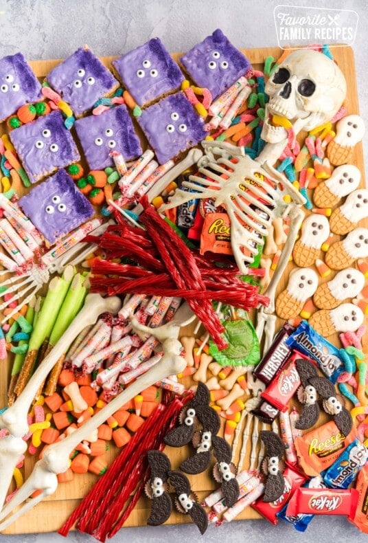 Halloween charcuterie board filled with candy and spooky treats