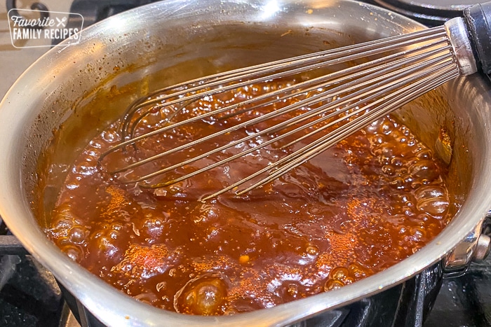 Honey bbq sauce boiling in a saucepan