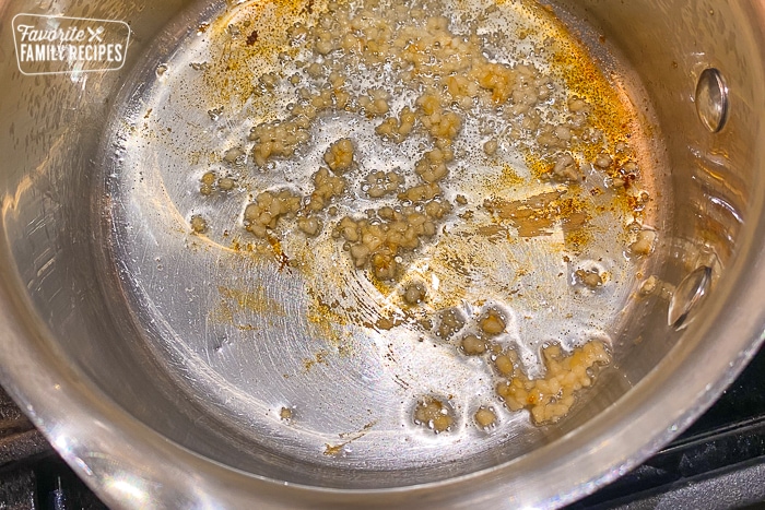 Garlic being sautéed for honey bbq chicken