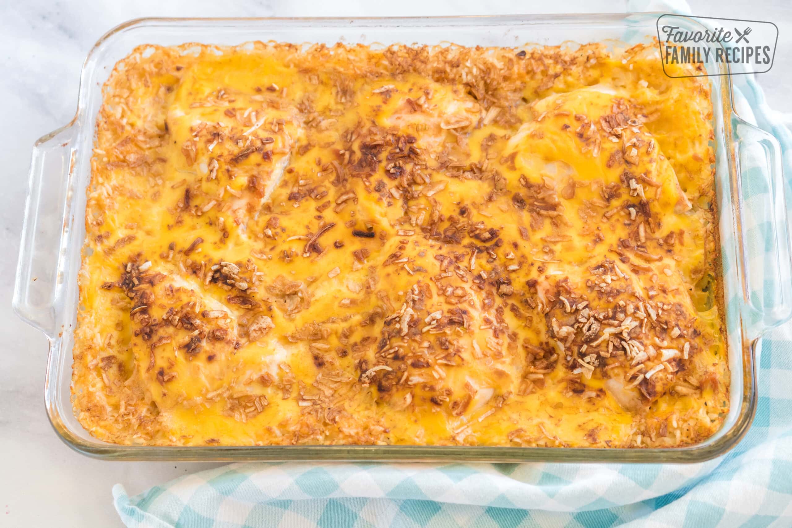 Cheesy chicken and rice casserole in a glass baking dish