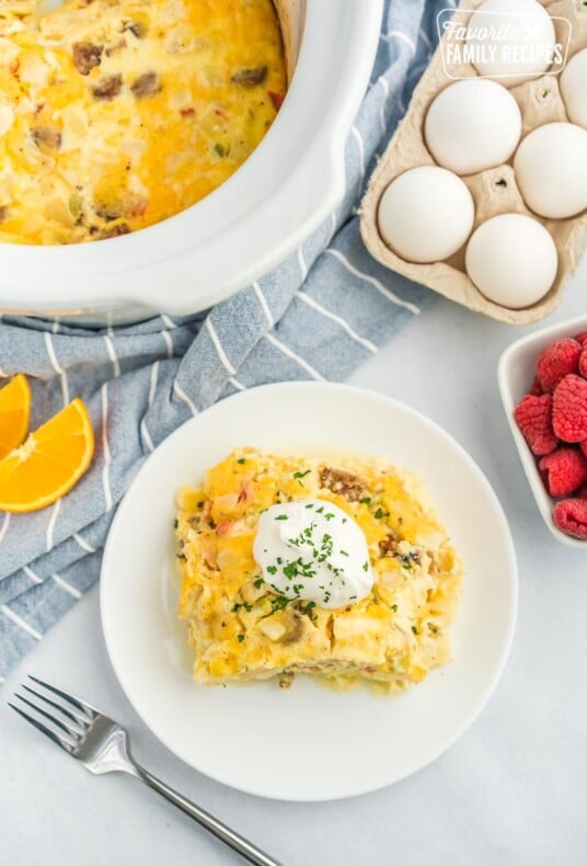 A plate with a slice of breakfast casserole on it