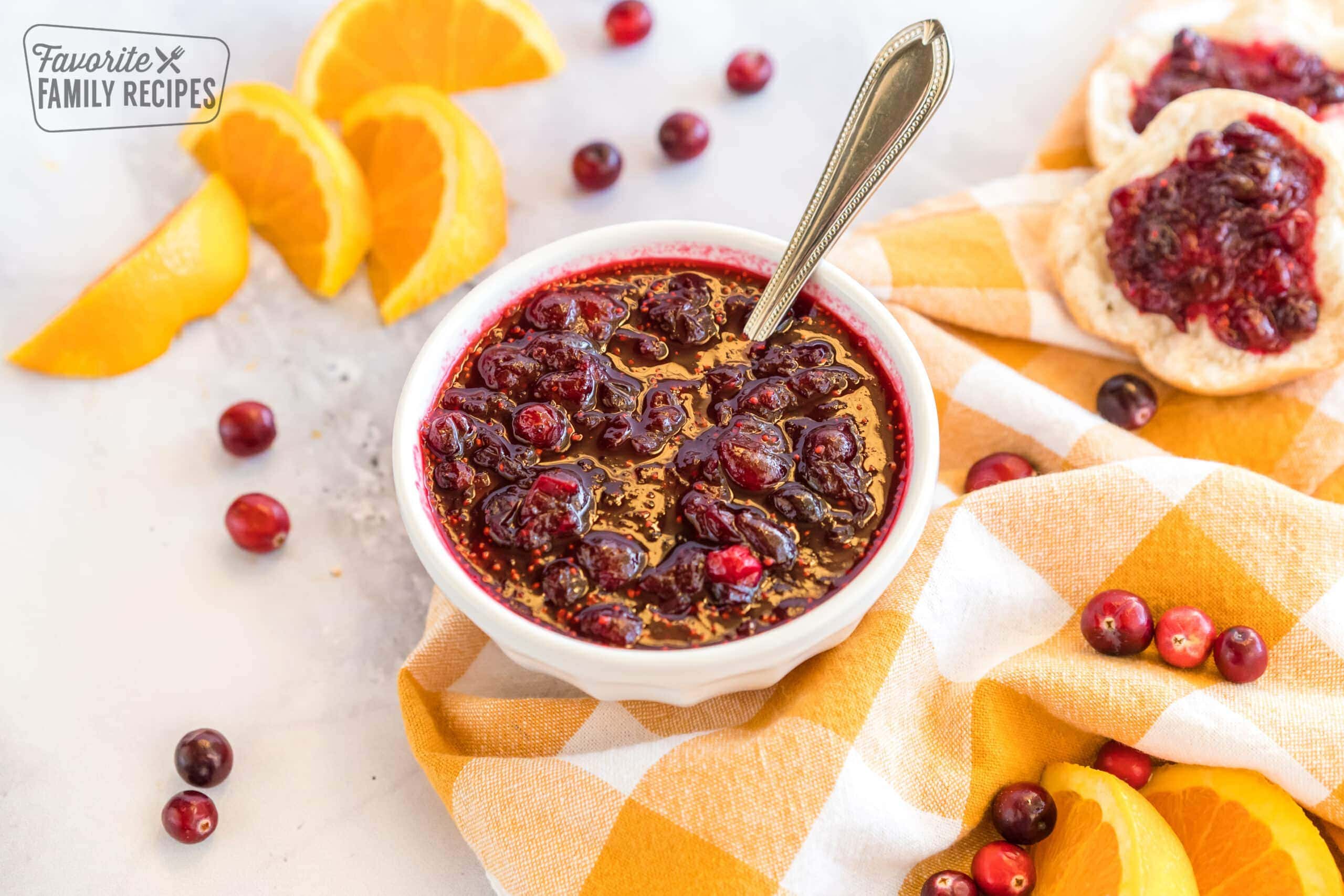 A bowl of homemade cranberry orange sauce on a gingham napkin