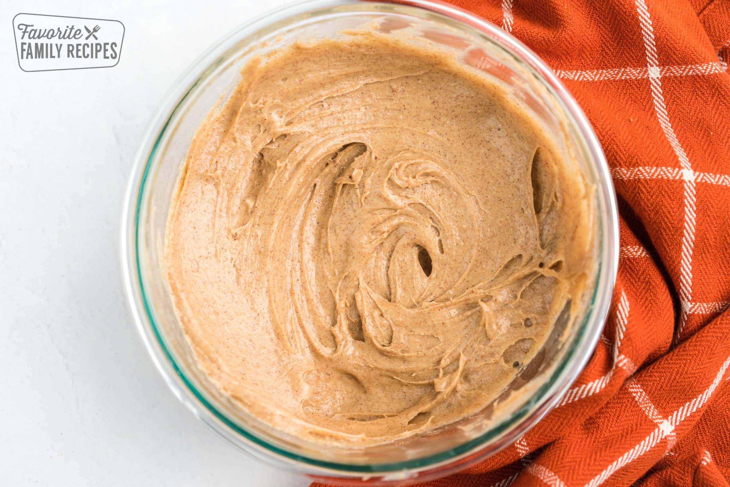 Cream cheese, pumpkin pie spice, and brown sugar mixed together in a bowl