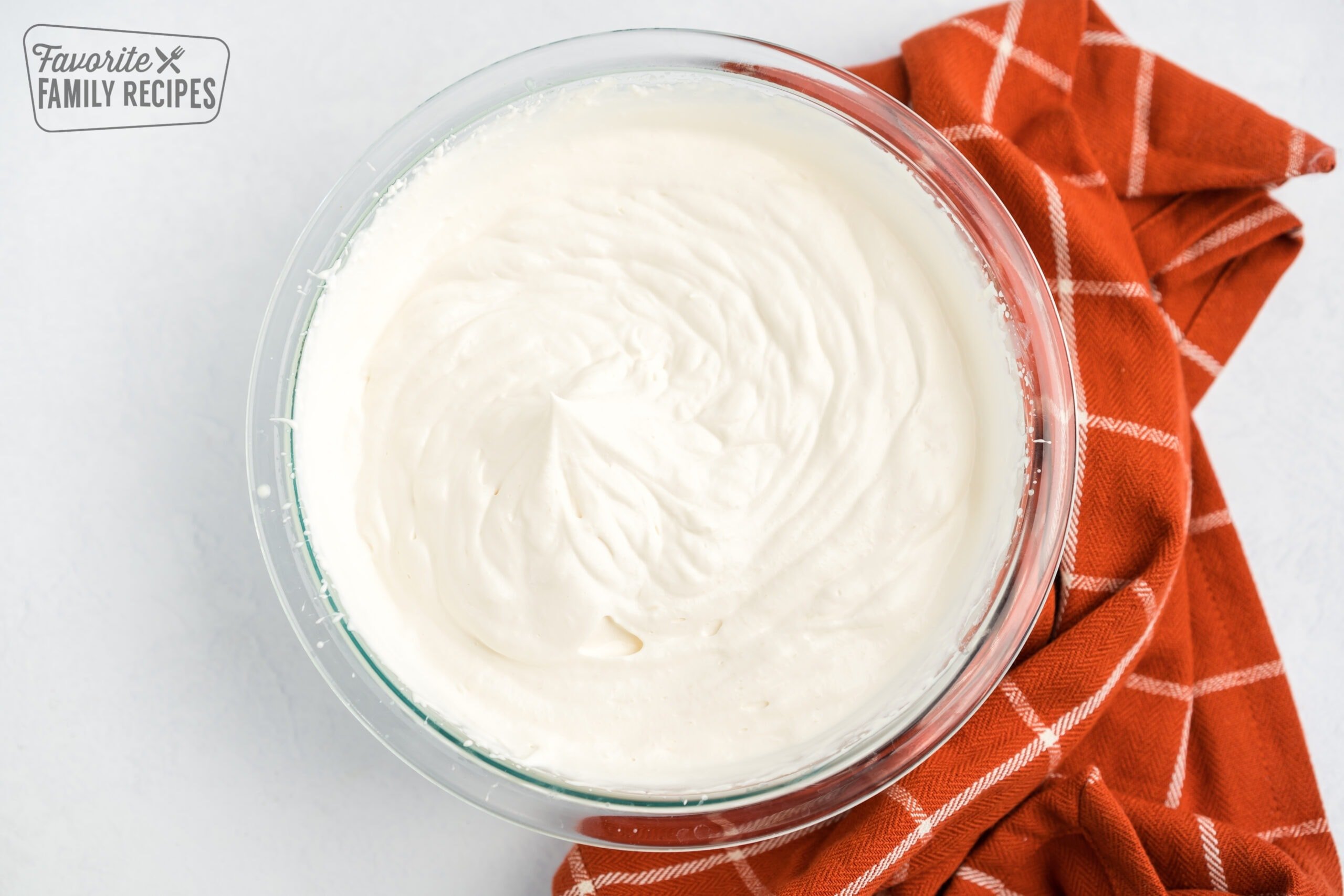 Whipped cream in a glass bowl