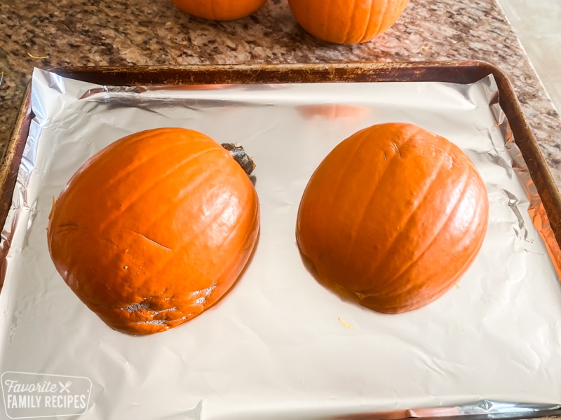 Pumpkins cut in half and ready to be roasted