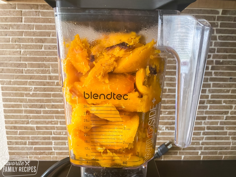 Cooked pumpkin in a blender ready to blend