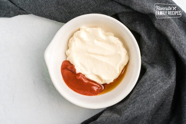 Mayo, sriracha, and sesame oil in a bowl