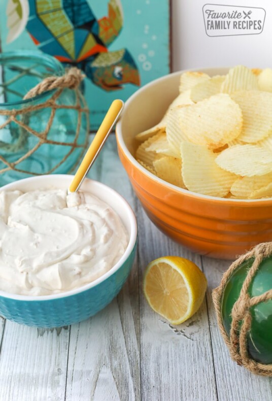 Bowl of Clam Dip next to a bowl of Ruffled Potato Chips