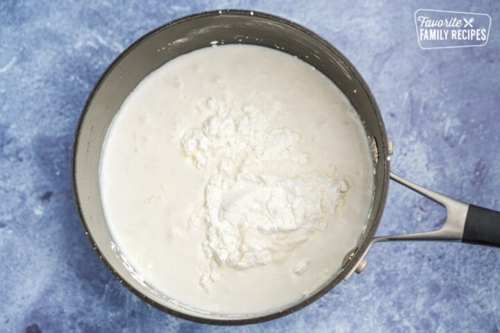 Half and half, coconut milk, cornstarch, sugar, eggs, and salt in a pot
