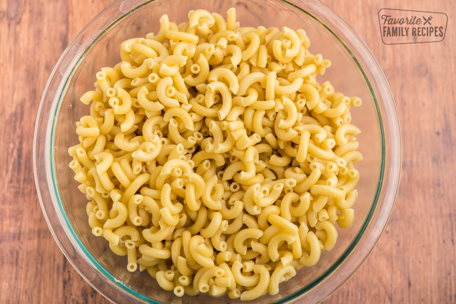 Cooked elbow macaroni in a glass bowl