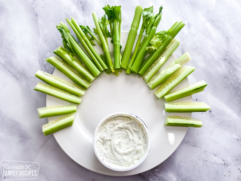 Celery and cut cucumber on a plate