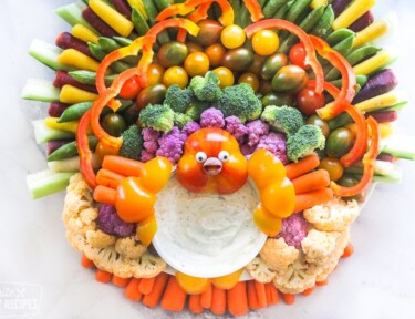 Vegetables on a serving platter organized to look like a turkey