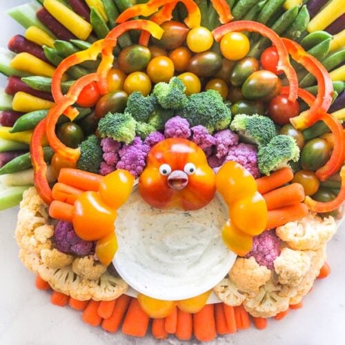 Vegetables on a serving platter organized to look like a turkey