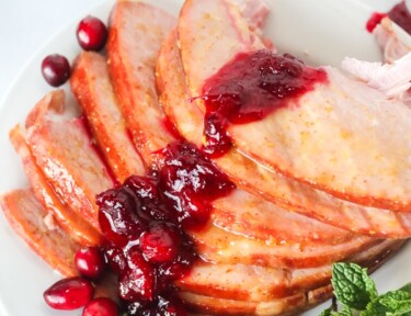 Sliced Christmas Ham with cranberry sauce