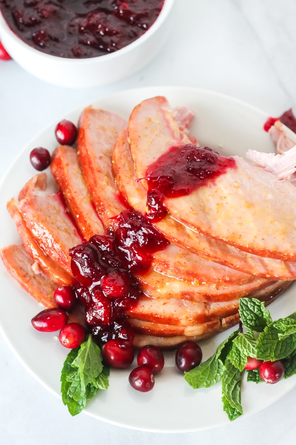 Sliced Christmas Ham with cranberry sauce
