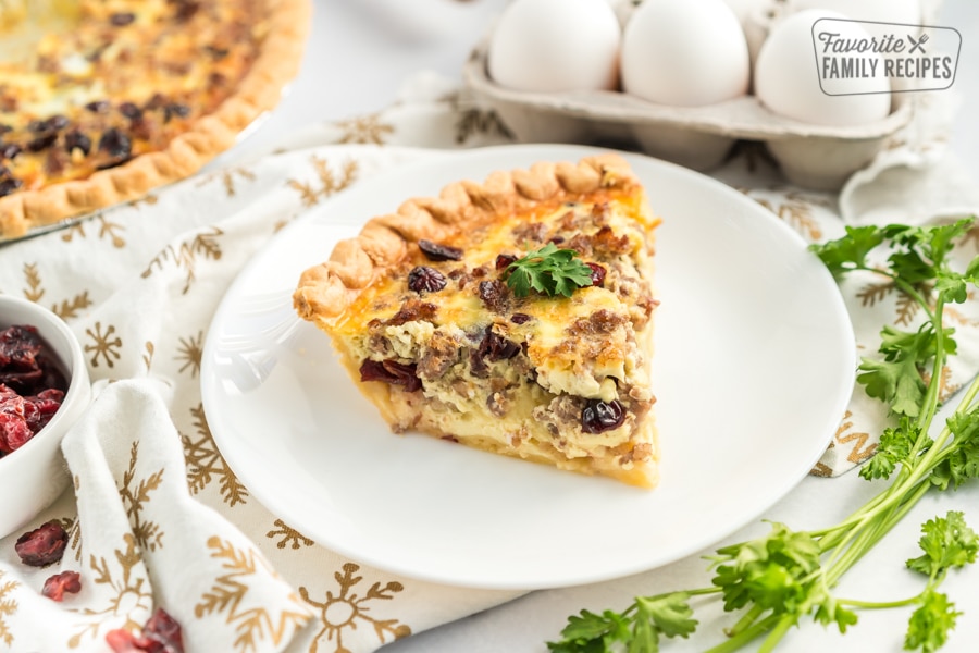 A slice of Christmas Breakfast Quiche on a plate