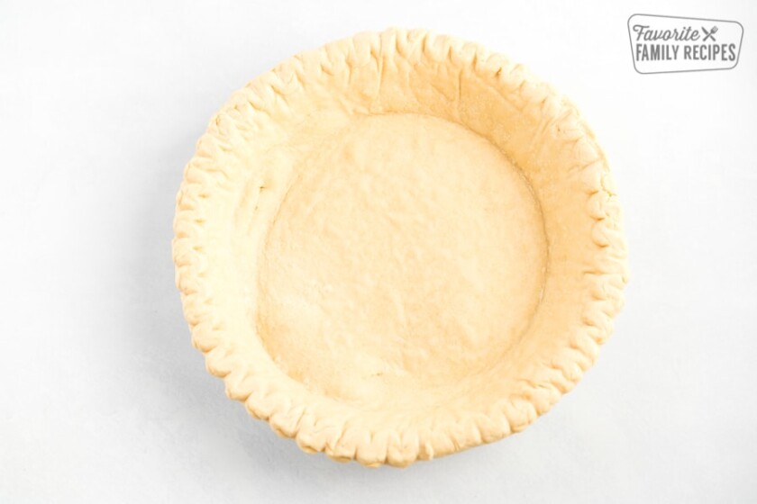 An empty partially baked pie crust