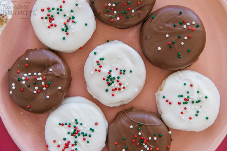 Ritz cookies dipped in milk and white chocolate with sprinkles