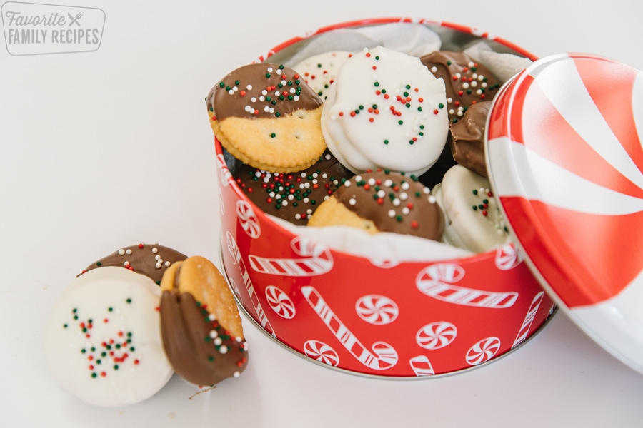 Dipped Ritz cookies in a Christmas tin