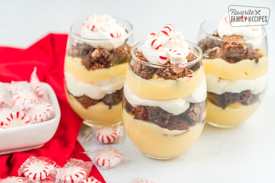 Three peppermint parfaits topped with crushed peppermint