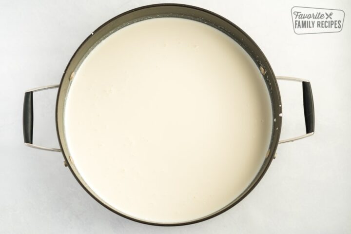 Milk, white chocolate chips, sweetened condensed milk, and peppermint extract in a large pot