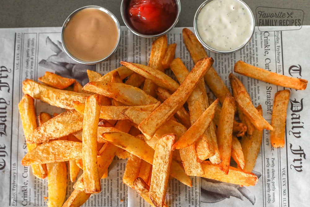 Air Fryer French fries laid out on newspaper to cool